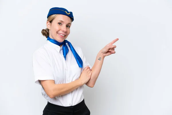 飛行機ブロンドスチュワーデス女性隔離された上に白い背景指差し指に側 — ストック写真