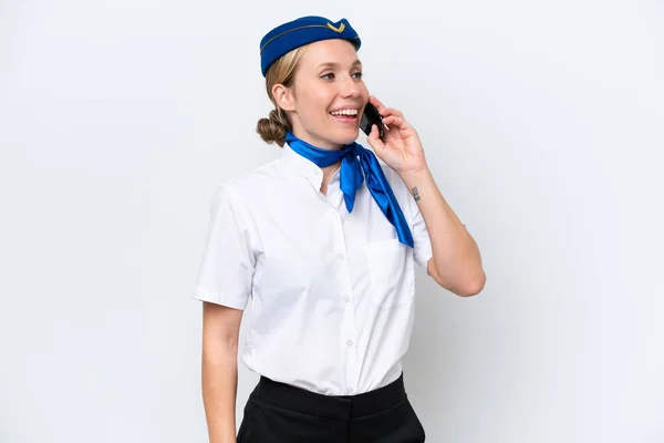 飛行機ブロンドスチュワーデス女性隔離された白い背景に携帯電話との会話を保つ — ストック写真