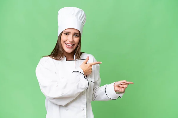 Young Chef Caucasian Woman Isolated Background Surprised Pointing Side — Stock Photo, Image
