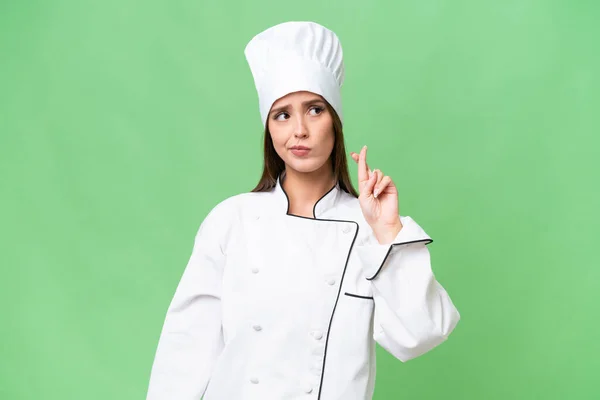 Giovane Chef Donna Caucasica Sfondo Isolato Con Dita Incrociate Augurando — Foto Stock