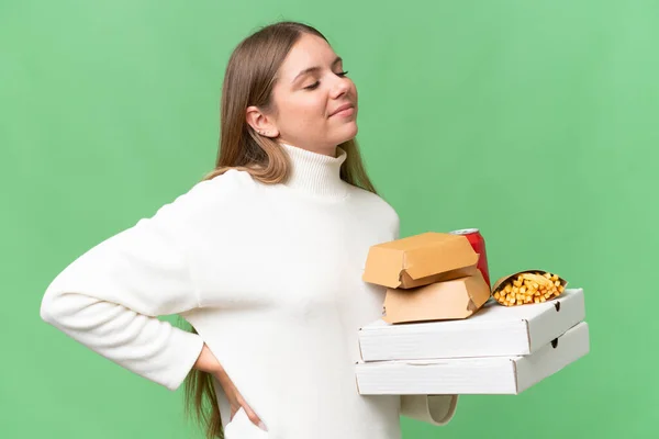 Young Beautiful Blonde Woman Holding Takeaway Food Isolated Background Suffering — Stock Photo, Image
