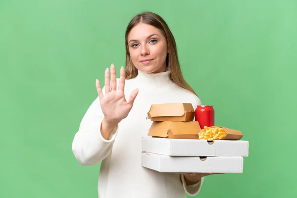 Young Beautiful Blonde Woman Holding Takeaway Food Isolated Background Counting — Stock Photo, Image