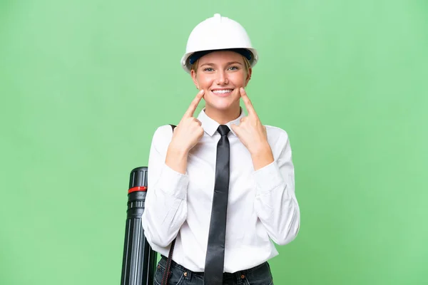Young Architect Caucasian Woman Helmet Holding Blueprints Isolated Background Smiling — Stock Photo, Image