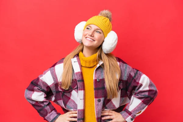Young Beautiful Woman Wearing Winter Muffs Isolated Red Background Posing — Stock Photo, Image