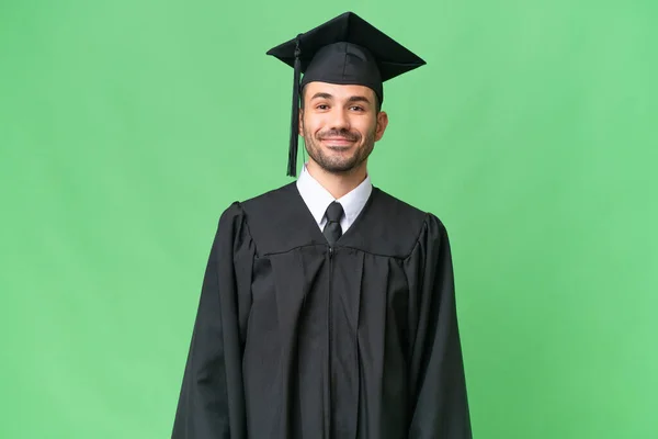 Νεαρός Απόφοιτος Πανεπιστημίου Πάνω Από Απομονωμένη Φόντο Γέλιο — Φωτογραφία Αρχείου