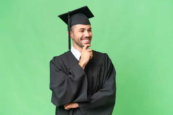 Young University Graduate Man Isolated Background Looking Side — Stock Photo, Image