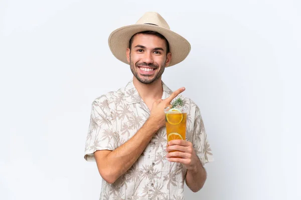Young Caucasian Man Holding Cocktail Isolated White Background Pointing Side — Stock Photo, Image