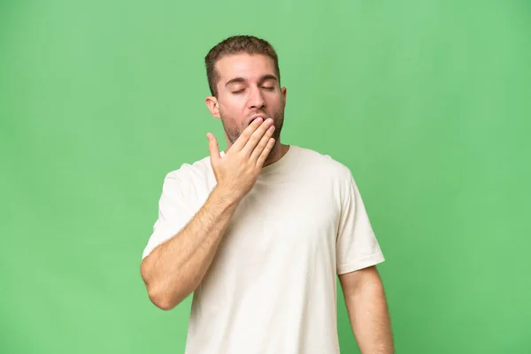 Young Handsome Caucasian Man Isolated Green Chroma Background Yawning Covering — Stock Photo, Image
