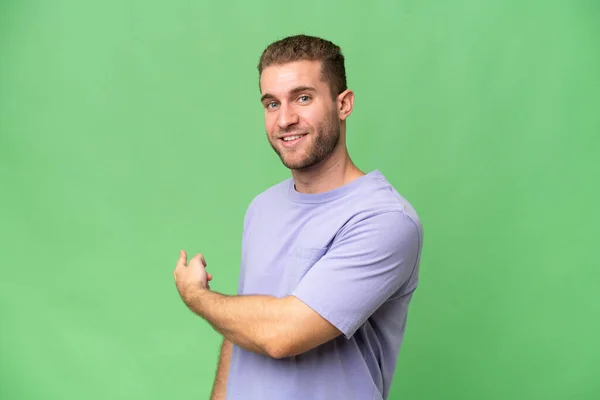 Young Handsome Caucasian Man Isolated Green Chroma Background Pointing Back — Stock Photo, Image