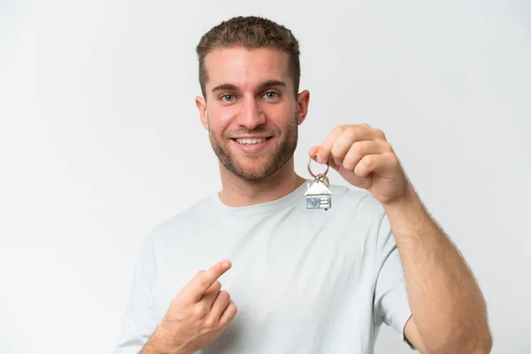 Young Caucasian Man Holding Home Keys Isolated White Background Pointing — Stock Photo, Image