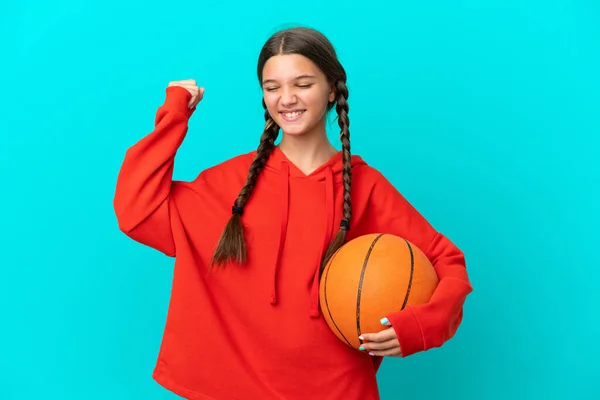 Little Caucasian Girl Playing Basketball Isolated Blue Background Celebrating Victory — Foto Stock