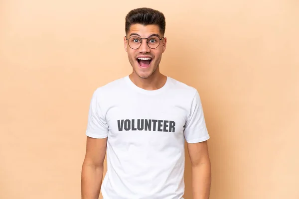 Young Volunteer Caucasian Man Isolated Beige Background Surprise Facial Expression — Stock Photo, Image