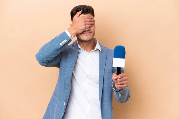 Young caucasian TV presenter man isolated on white background covering eyes by hands. Do not want to see something