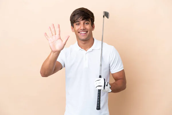 Joven Jugador Golf Hombre Aislado Ocre Fondo Contando Cinco Con — Foto de Stock