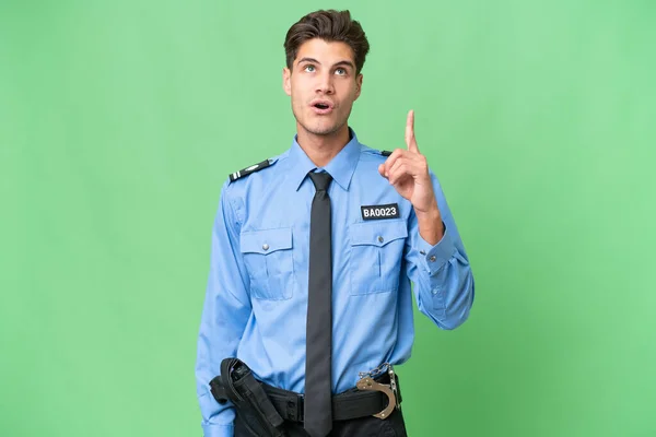 Молодой Полицейский Изолированном Фоне Думая Идея Указывает Пальцем Вверх — стоковое фото