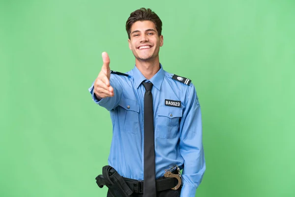 Young Police Man Isolated Background Shaking Hands Closing Good Deal — Stock Photo, Image