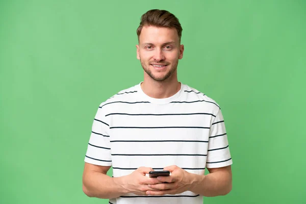 Young Blonde Caucasian Man Isolated Background Surprised Sending Message — Stock Photo, Image