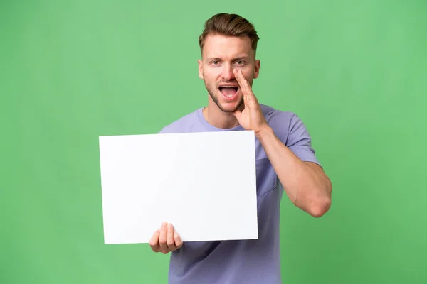 Young Blonde Caucasian Man Isolated Background Holding Empty Placard Shouting — Stock Photo, Image
