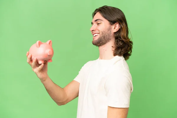 Young Handsome Man Holding Piggybank Isolated Background Happy Expression — Stock Photo, Image