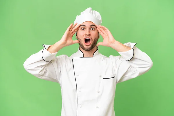 Mladý Pohledný Kuchař Muž Přes Izolované Pozadí Překvapivým Výrazem — Stock fotografie