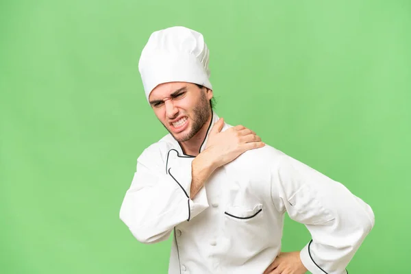 Jovem Bonito Chef Homem Sobre Isolado Fundo Sofrendo Dor Ombro — Fotografia de Stock