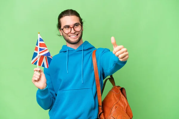 Mladý Pohledný Muž Drží Britskou Vlajku Nad Izolovaným Pozadím Dává — Stock fotografie