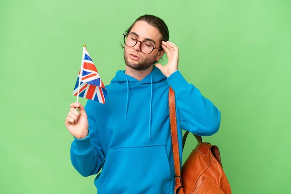 Fiatal Jóképű Férfi Tartó Egyesült Királyság Zászló Felett Elszigetelt Háttér — Stock Fotó