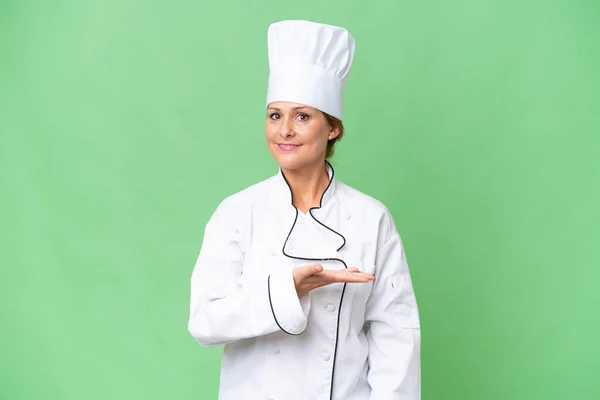 Middle Aged Chef Woman Isolated Background Presenting Idea While Looking — Stock Photo, Image