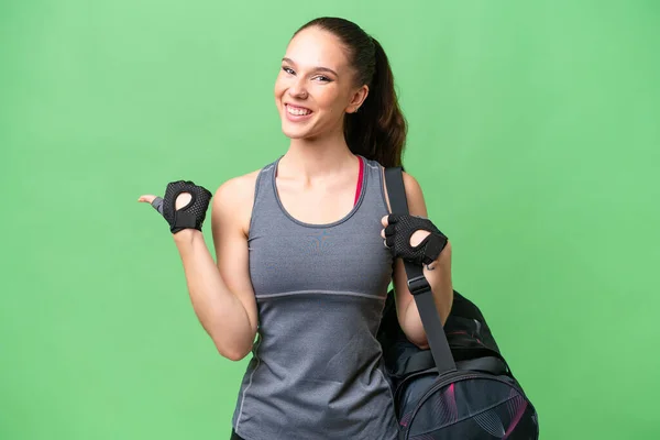 Young Sport Woman Sport Bag Isolated Background Pointing Side Present — Foto Stock