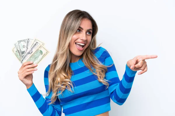 Young Uruguayan Woman Taking Lot Money Isolated White Background Pointing — Stock Photo, Image