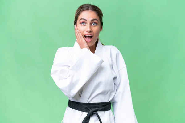 Mujer Uruguaya Joven Haciendo Karate Sobre Fondo Aislado Con Sorpresa — Foto de Stock
