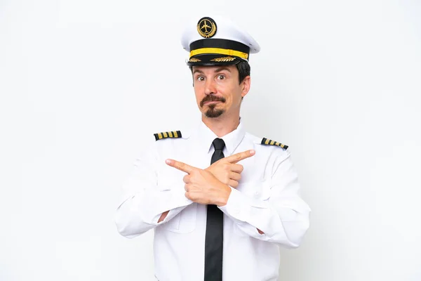 Airplane Caucasian Pilot Isolated White Background Pointing Laterals Having Doubts — Fotografia de Stock