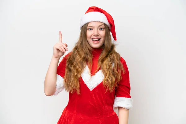 指を持ち上げながら解決策を実現しようとして白い背景に隔離されたクリスマスのドレスを持つ若い白人女性 — ストック写真