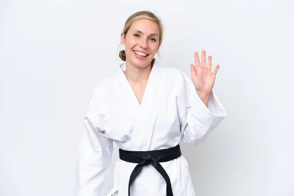 Joven Mujer Caucásica Haciendo Karate Aislado Sobre Fondo Blanco Saludando —  Fotos de Stock