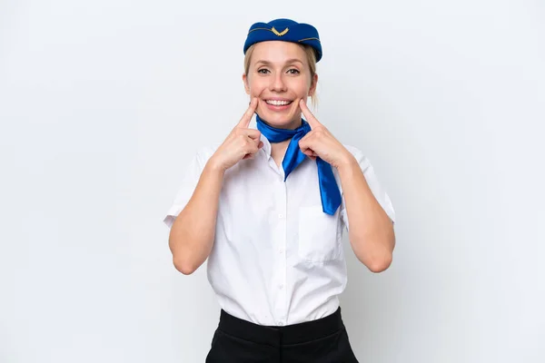 飛行機ブロンドスチュワーデス女性孤立した上に白い背景笑顔でA幸せと快適な式 — ストック写真