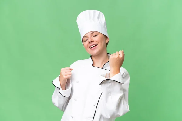 Młody Szef Kuchni Kobieta Odizolowane Zielone Tło — Zdjęcie stockowe