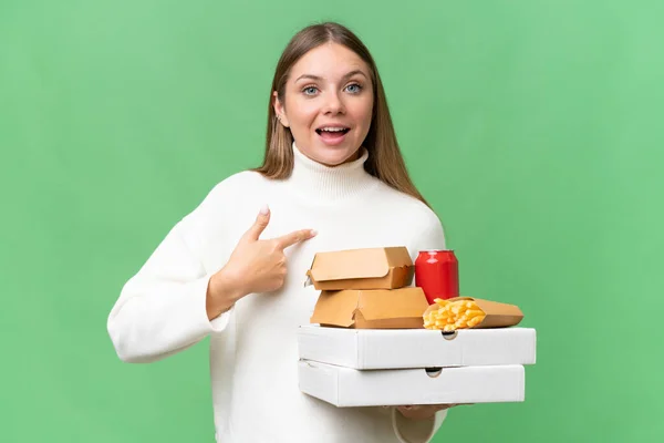 Young Beautiful Blonde Woman Holding Takeaway Food Isolated Background Surprise — Stock Photo, Image