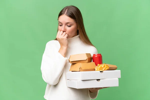 Young Beautiful Blonde Woman Holding Takeaway Food Isolated Background Having — Stock Photo, Image