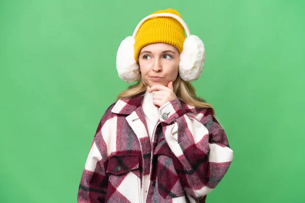 Young English Woman Wearing Winter Muffs Isolated Background Having Doubts — Stock Photo, Image