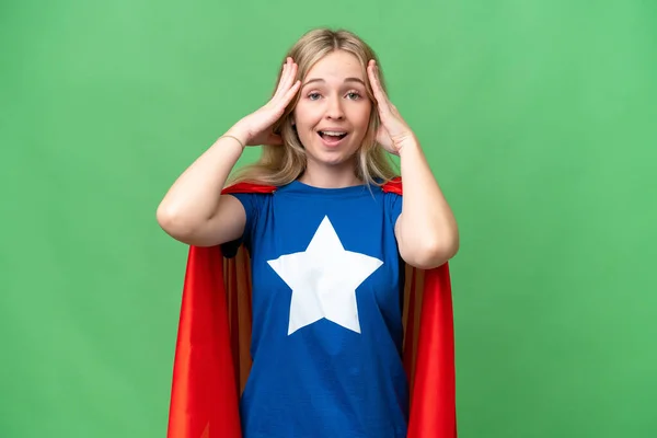 Super Hero English woman over isolated background with surprise expression