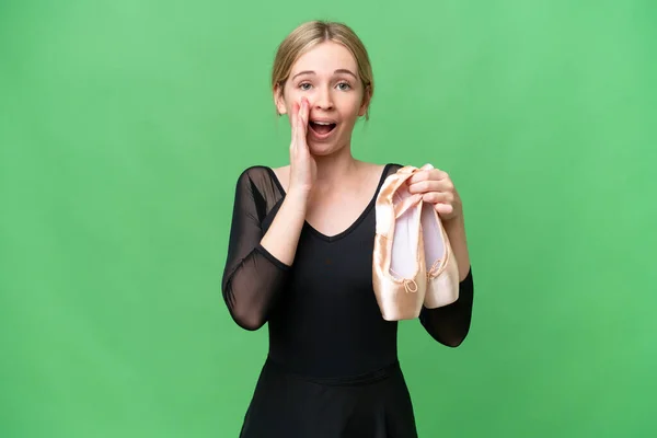 Young English woman practicing ballet over isolated background with surprise and shocked facial expression
