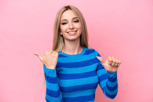 Pretty Blonde Woman Isolated Pink Background Pointing Side Present Product — 스톡 사진