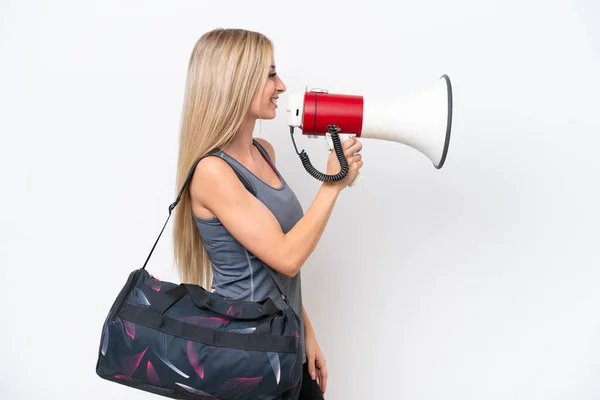Young Sport Woman Sport Bag Isolated White Background Shouting Megaphone — 스톡 사진