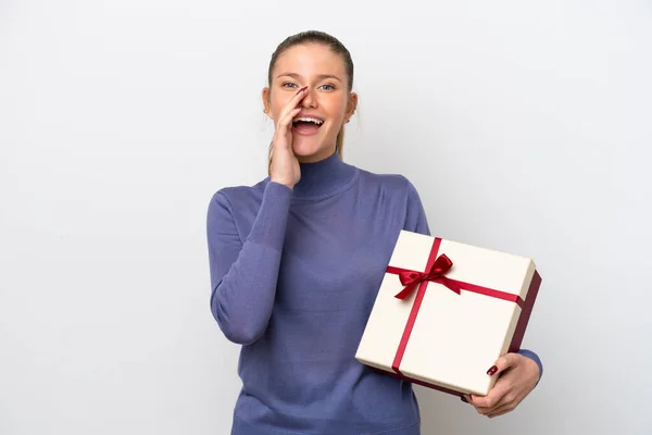 Young Caucasian Woman Holding Gift Isolated White Background Shouting Mouth — 스톡 사진