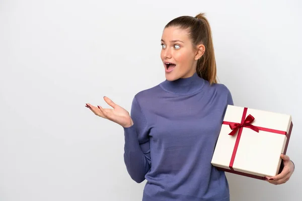 Young Caucasian Woman Holding Gift Isolated White Background Surprise Facial — 스톡 사진