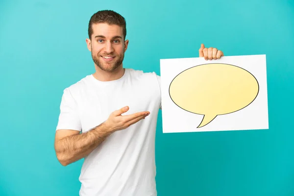 Handsome Blonde Man Isolated Blue Background Holding Placard Speech Bubble — ストック写真