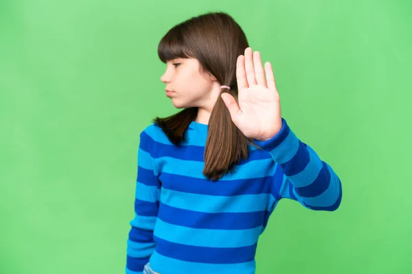 stock image Little caucasian girl over isolated background making stop gesture and disappointed