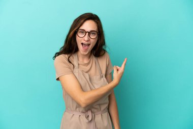 Restaurant waiter surprised and pointing side