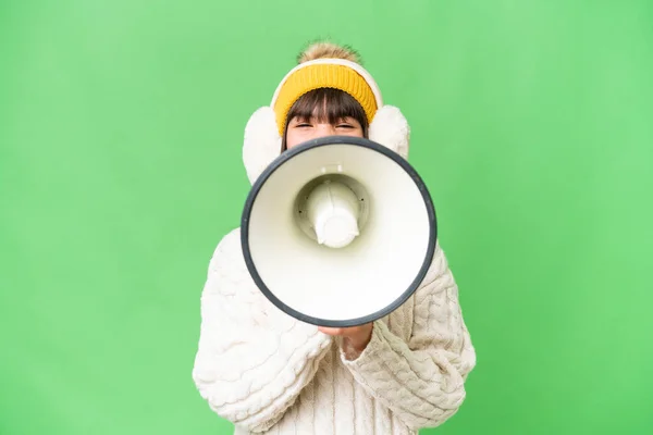 Little Caucasian Girl Wearing Winter Muffs Isolated Background Shouting Megaphone — Stock Photo, Image