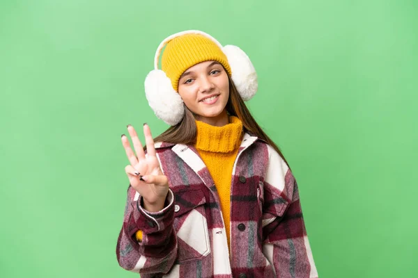 年轻的高加索女孩 穿着冬衣 背景孤寂 手指头数三声 — 图库照片